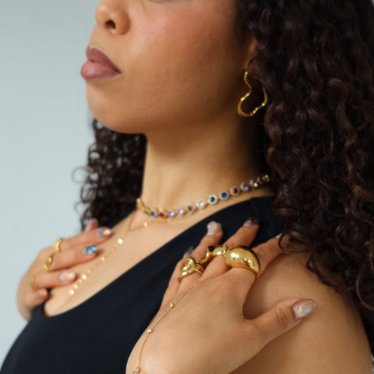 Woman wearing gold waterfroof jewelry.