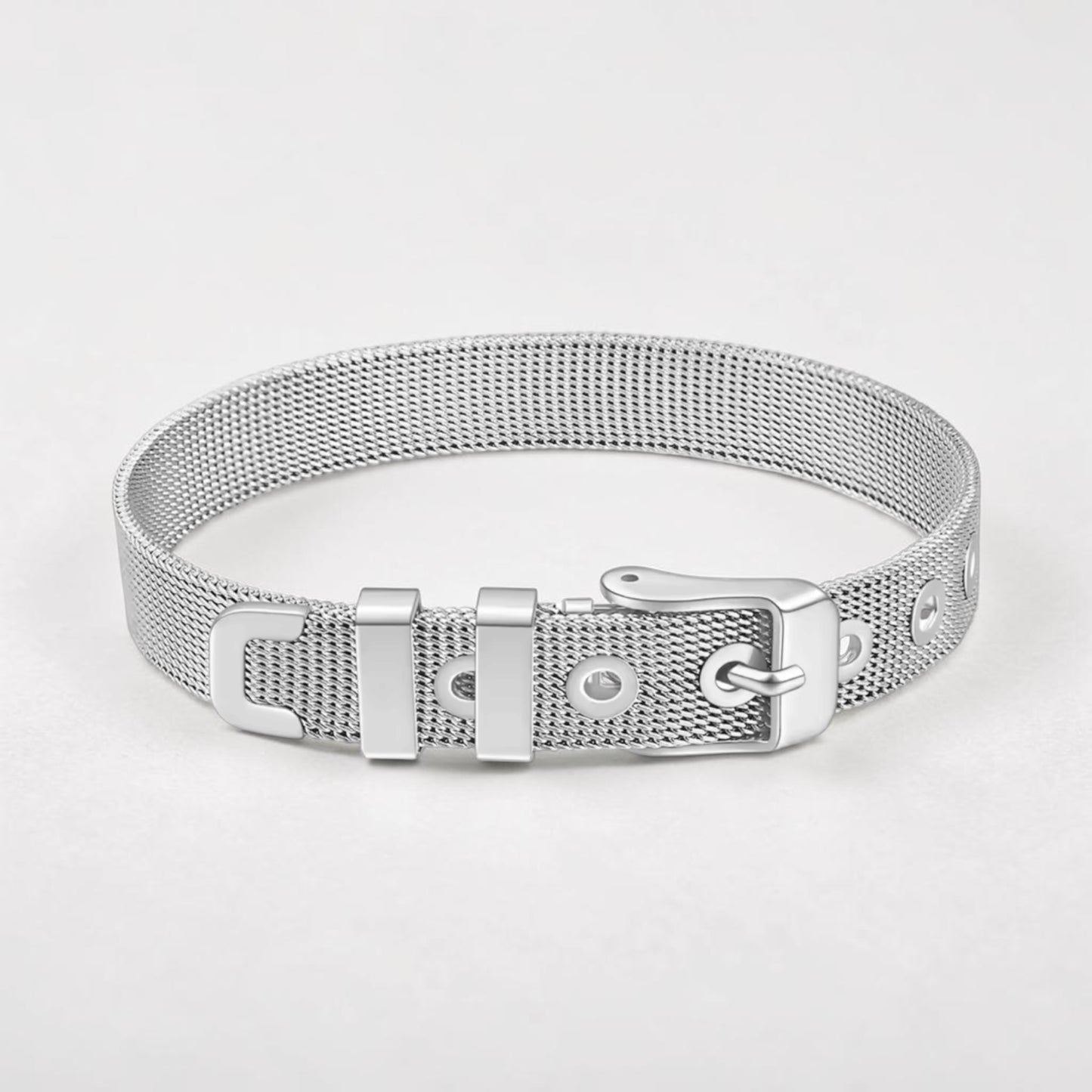 Silver mesh bracelet on a light gray background